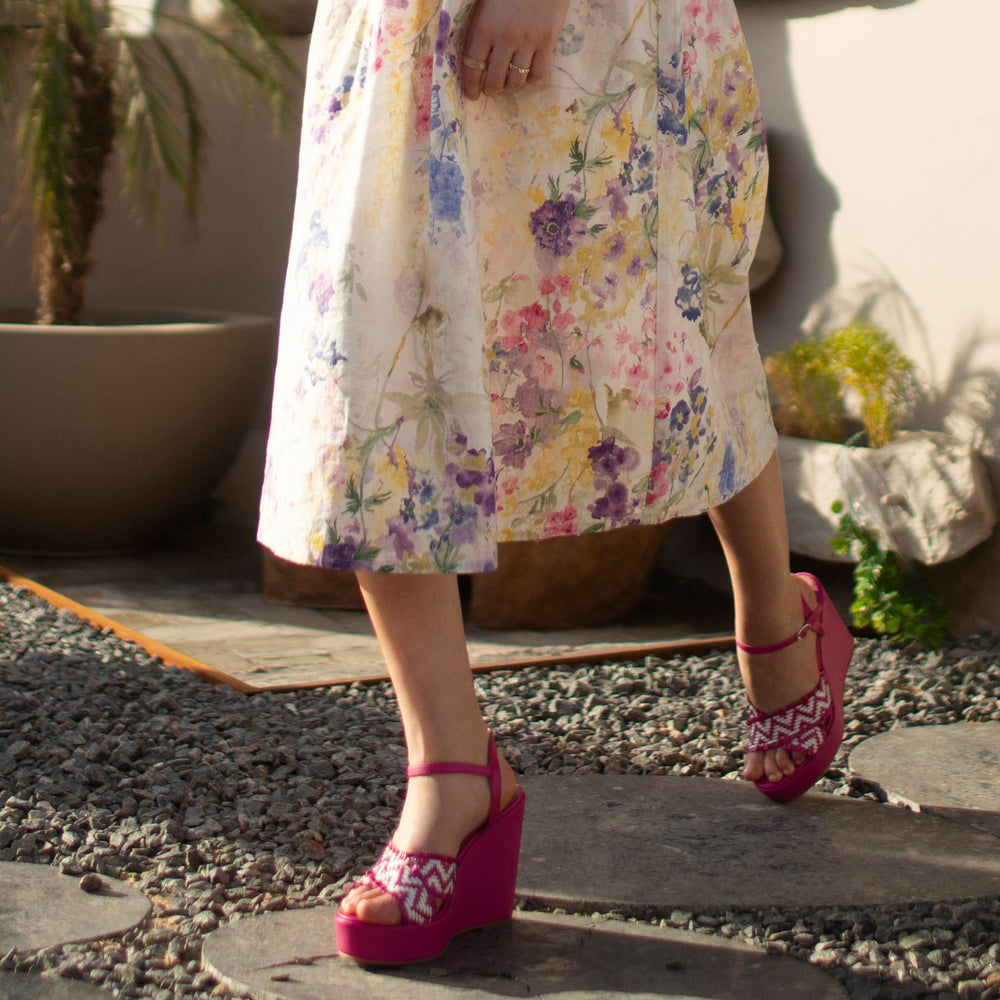 Elevate your look with Saint Glenda's handwoven hot pink wedge heels