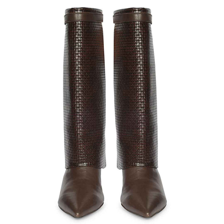 A pair of dark brown pointed-toe boots with tall, textured woven shafts and smooth leather lower sections