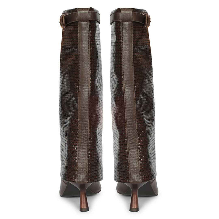 A pair of dark brown knee-high boots with a textured crocodile pattern and slim pointed heels