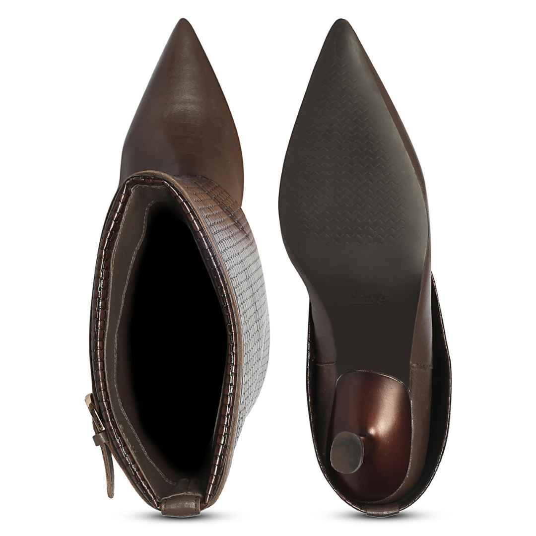 A pair of pointed-toe ankle boots shown from the side and sole views