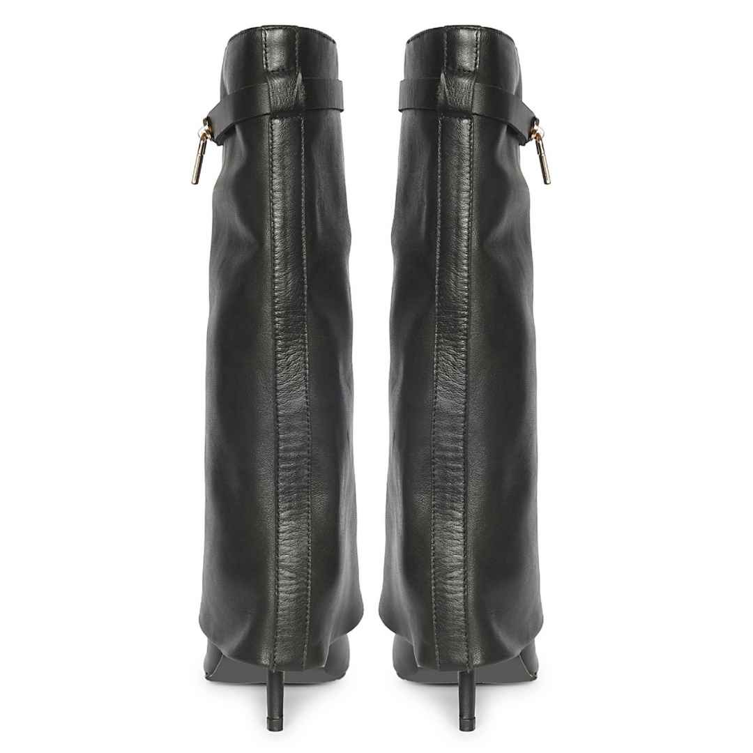 A pair of black leather knee-high boots with a side strap and gold-tone hardware
