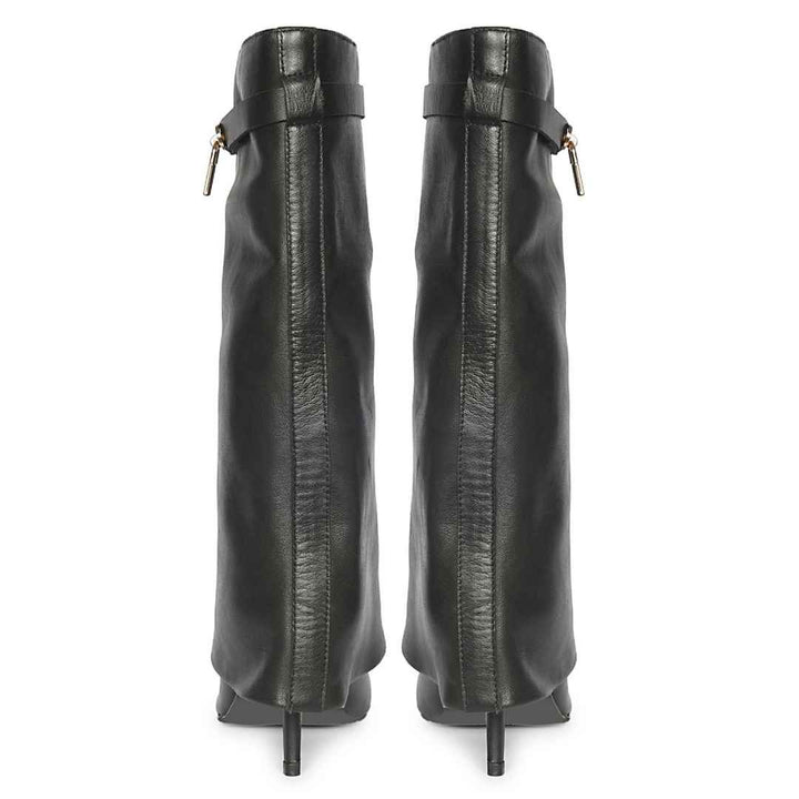 A pair of black leather knee-high boots with a side strap and gold-tone hardware