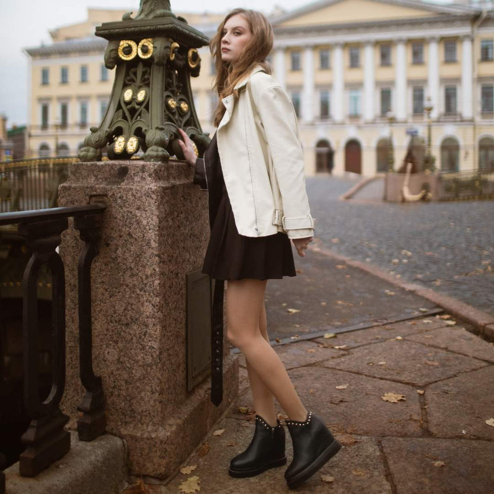 Saint Emily Black Suede Wedge Boots: Elevate your style with these chic ankle boots featuring a comfortable inner wedge heel in luxurious black suede leather.