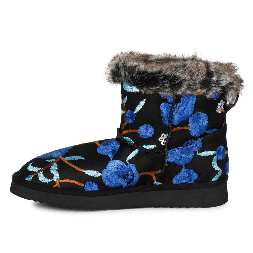 Suede leather snug boots with vibrant blue floral embroidery by Saint Clarisse