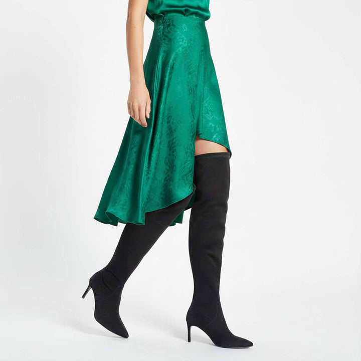 green dress and black knee-high boots