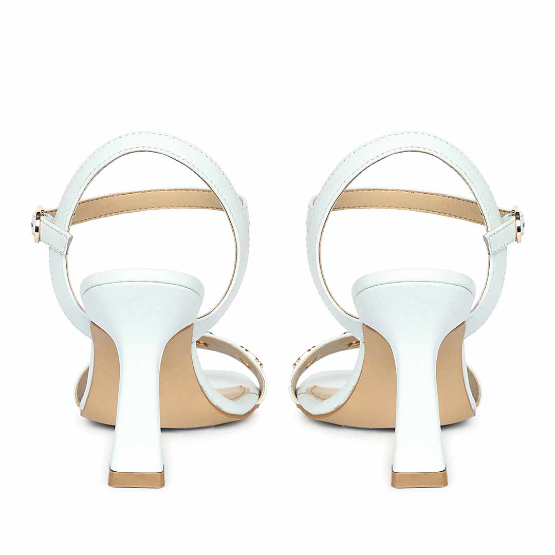 Saint Dahlia Gold Flower Eyelets Sky Leather Heels