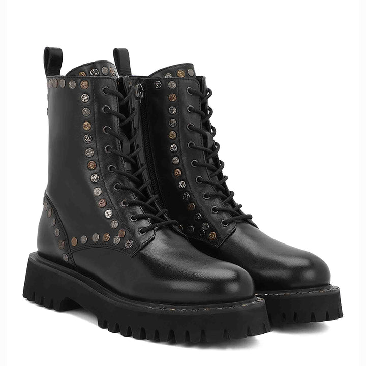 Sleek and edgy SAINT NATALIE boots with metal studs, lace-up design, and high ankle for a stylish look