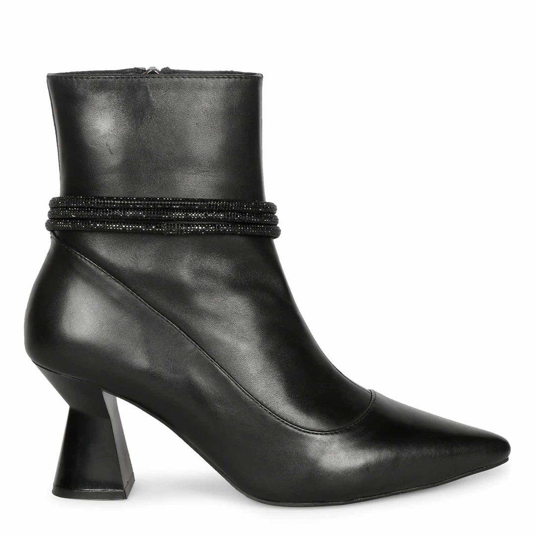 Saint Madelyn Zip-Up Heel Boots - Walk in style with these black leather boots featuring a front zipper for easy wear. The pointed toe and chic design make them a must-have for any fashion-forward individual.