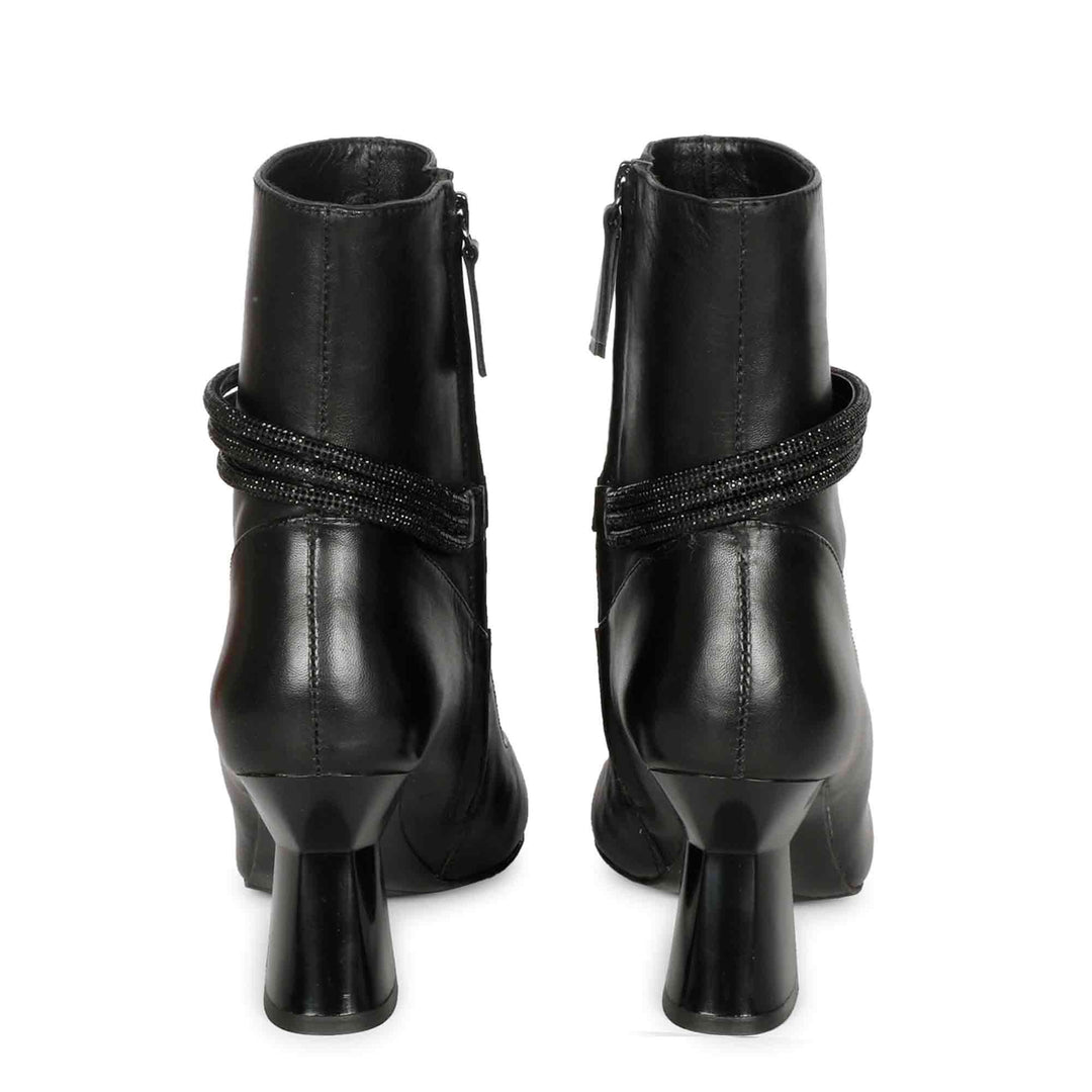 Saint Madelyn Zip-Up Heel Boots - Walk in style with these black leather boots featuring a front zipper for easy wear. The pointed toe and chic design make them a must-have for any fashion-forward individual.