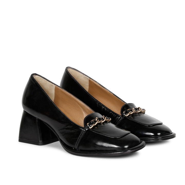 Step into luxury: Saint Mirielle's black patent leather moccasins - handcrafted perfection