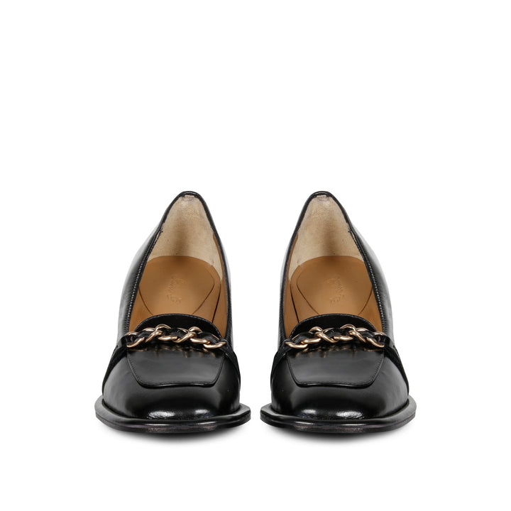 Step into luxury: Saint Mirielle's black patent leather moccasins - handcrafted perfection