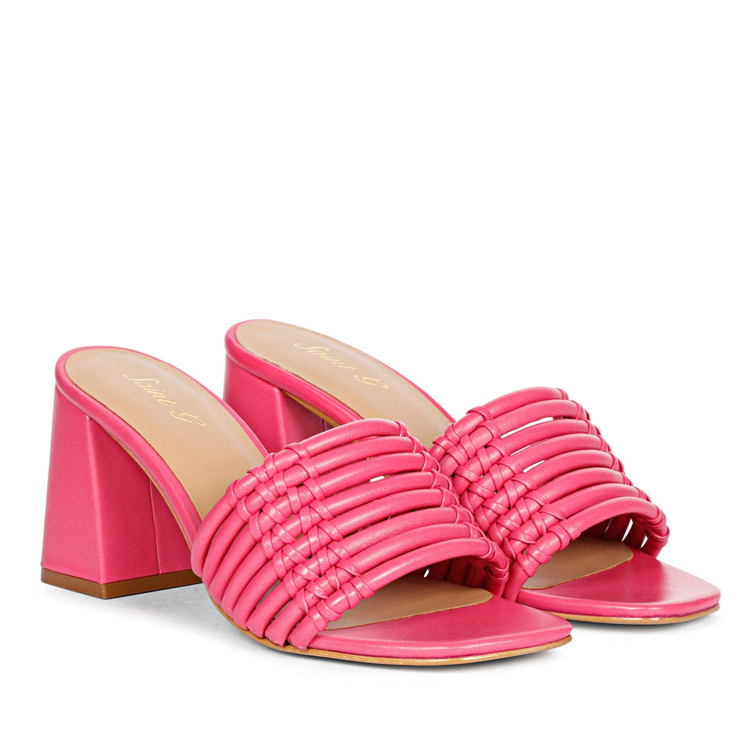 Strappy hot pink heels by Saint Bethany - elevate your style with these leather block heels